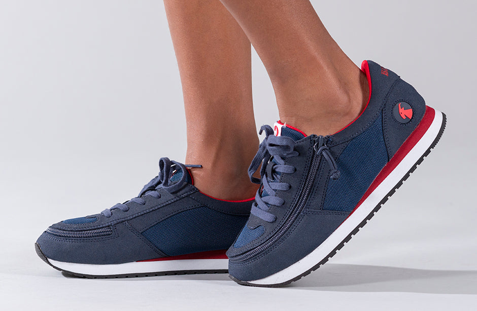 Kid's Navy/Red BILLY Joggers, zipper shoes, like velcro, that are adaptive, accessible, inclusive and use universal design to accommodate an afo. Footwear is medium and wide width, M, D and EEE, are comfortable, and come in toddler, kids, mens, and womens sizing.